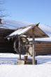 Old wooden house and draw-well