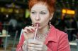 woman dreanking coffe in cafe and smiling happy
