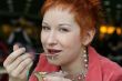 woman dreanking coffe in cafe and thoughtfully looks afar