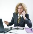 Unhappy businesswoman phoning