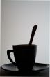 Black cup with a spoon