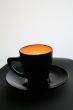 Black cup with orange light