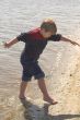 Boy Playing at the Ocean