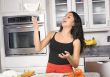 woman tossing pizza dough
