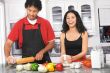 young couple cooking