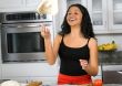 woman tossing pizza dough