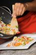 young chef plating food