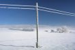 Winter lanscape with snowy telephone lines