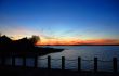 Lake house silhouette at the sunset