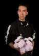 Man Holding Flowers Isolated on Black