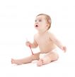 baby boy in diaper with toothbrush 2