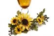 Big yellow wineglass with bouquet of sunflowers