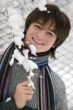 Pretty  European teens boy with snown branch