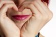 woman shows heart