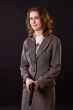 smiling businesswoman wtith gun
