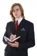 a businessman in a suit with a notebook
