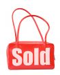 handbag with sold sign