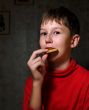 boy chews a cracker
