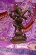 Bronze Ganesha dancing, on purple