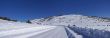 Tracks on snow covered road