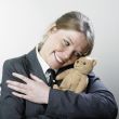 Woman hugging teddy bear