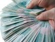 Hands, holding many of the Russian banknotes