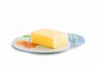 fresh and tasty slice of cheese, white background