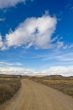 Lonely road under cloudy sky