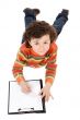 Boy write in clipboard