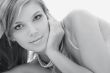 monochrome picture of mysterious blonde in pearls