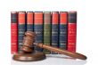 Wooden gavel and old law books