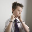 Handcuffed boy