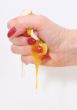 The female hand presses an egg on the night of February, 29th