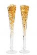 Two glasses with gold boluses