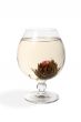 Glass with a flower green tea