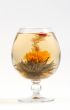 Glass with a flower green tea