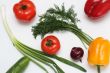 Multi-coloured vegetables for salad on a white background