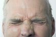 Man With Eyes Tightly Shut