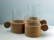 Three glass glasses in supports
