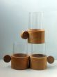 Three glass glasses in supports