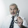 Businessman holding large key