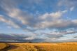 Lonely road under cloudy sky