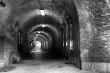 Gloomy medieval brick tunnel