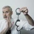 Man avoiding handcuffs