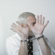 Handcuffed man and shame