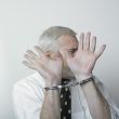Handcuffed man and shame