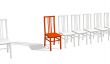 Red chair in a row of white chairs