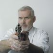 Old man with handgun