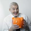 Happy man with piggy bank