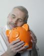 Man loving his piggy bank